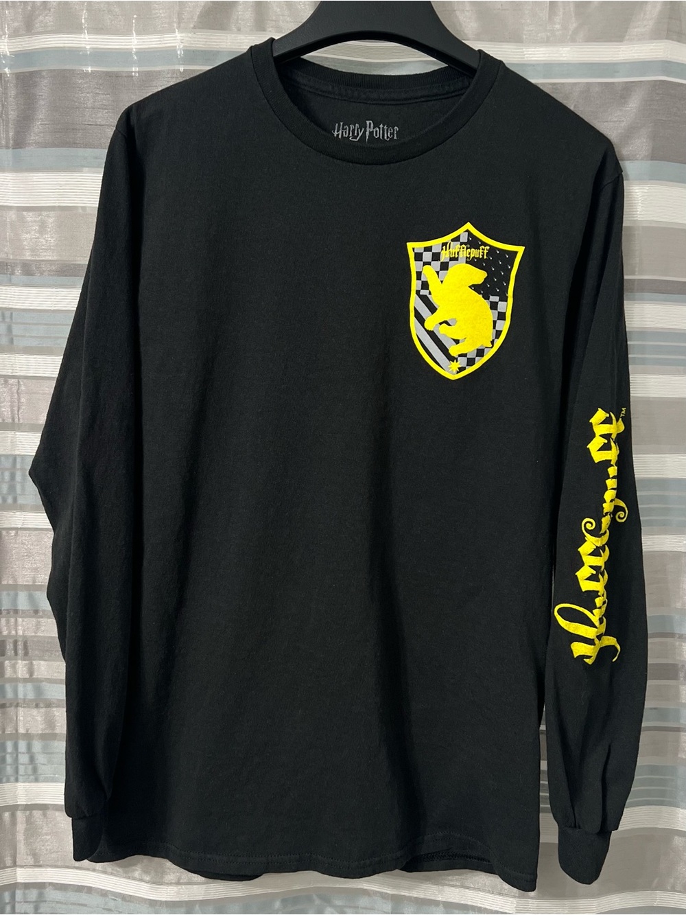 Harry Potter Black Long-Sleeve Hufflepuff Crest Tee with Yellow Sleeve Script